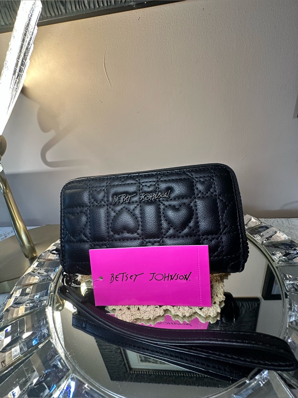 This black Betsey Johnson "XOKARA" quilted heart zip-around wallet
